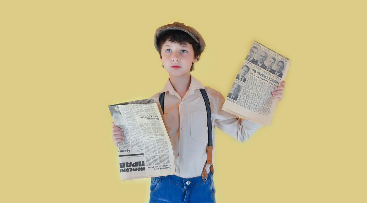 Junge mit Zeitung